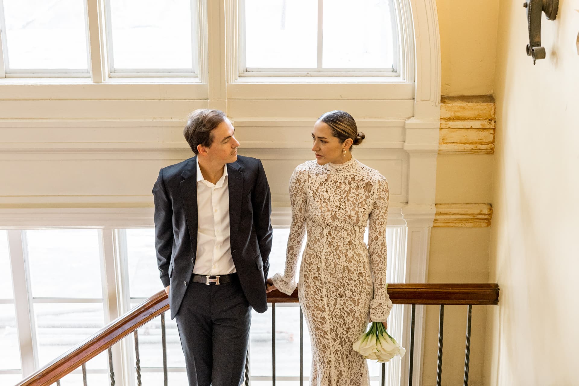 The couple on a sunlit staircase